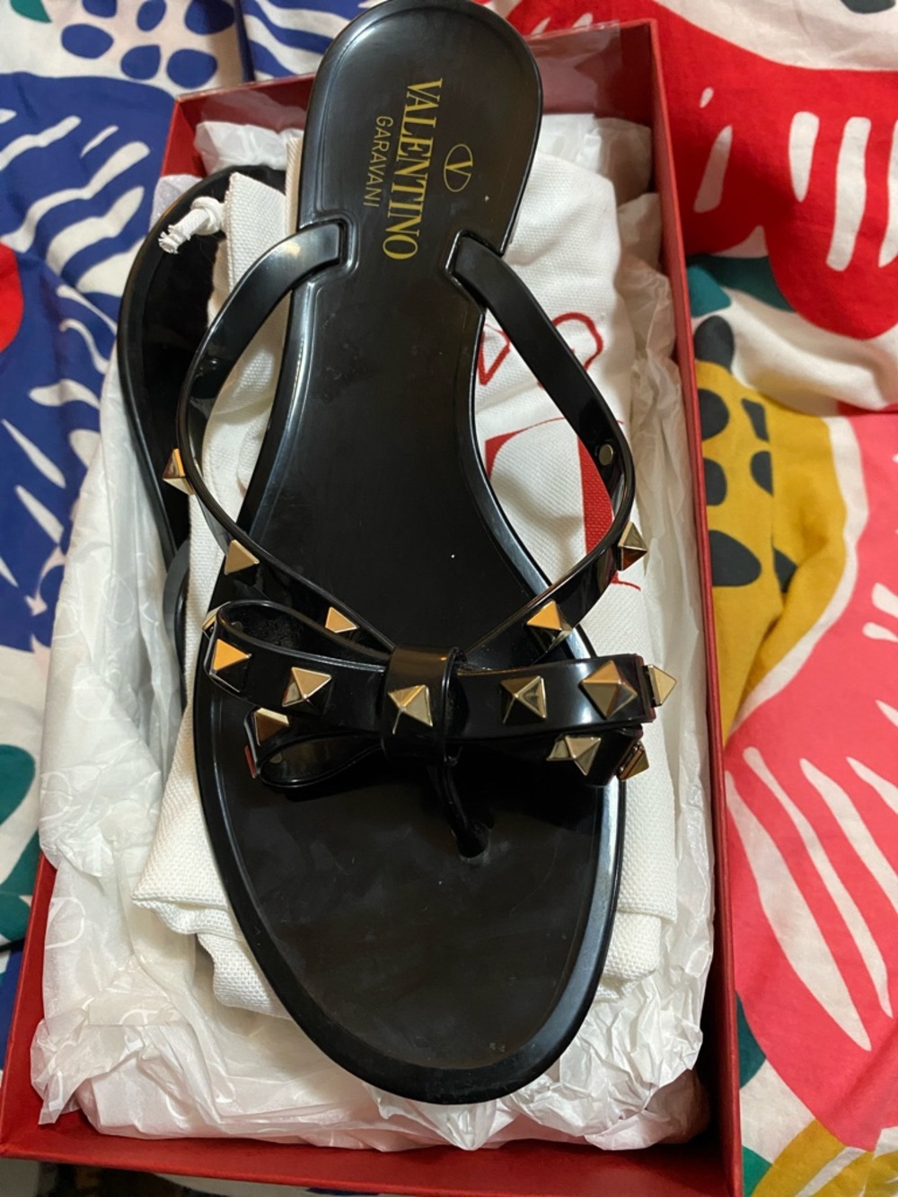 Valentino Garavani Black Jelly Rockstud Bow Thong Sandals with Gold Studs